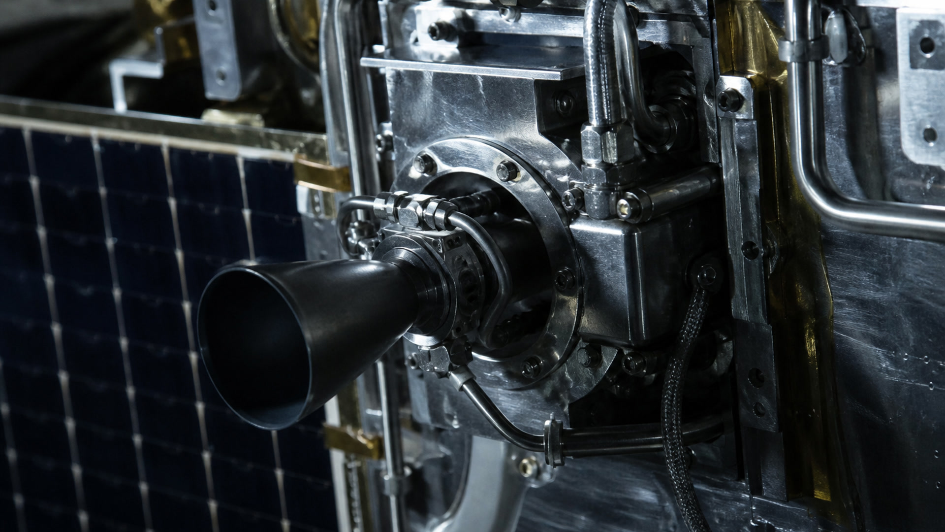 Thruster nozzle and feed lines on a bus.